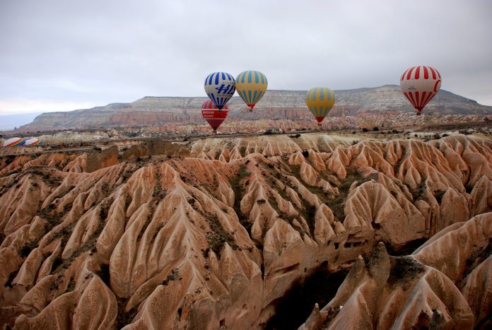 Cappadocia valleys and balloons — Voyazure Hot air balloons above the eroded valleys of Cappadocia