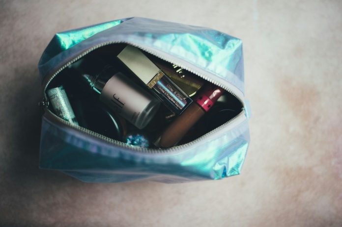 Carry-on toiletries and liquid containers Travel toiletries arranged for packing in cabin baggage